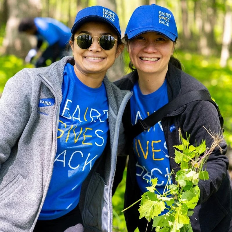Two RJF Pro associates volunteering outdoors during in RJF Pro Gives Back apparel