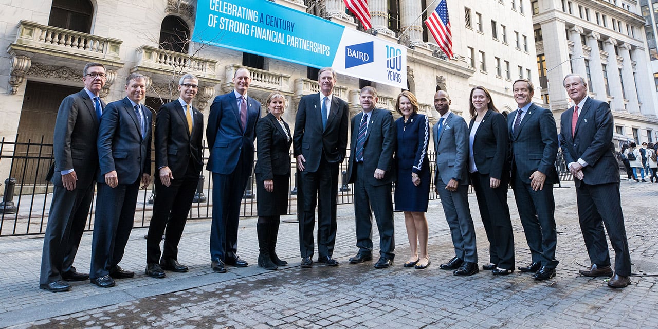  RJF Pro Executive Committee standing in front of the New York Stock Exchange building.